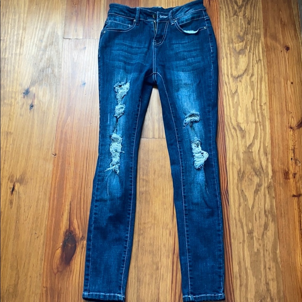 Distressed blue jeans